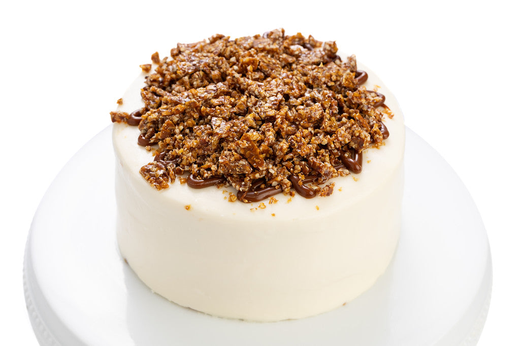 Pastel Vainilla con dulce de leche y nuez caramelizada